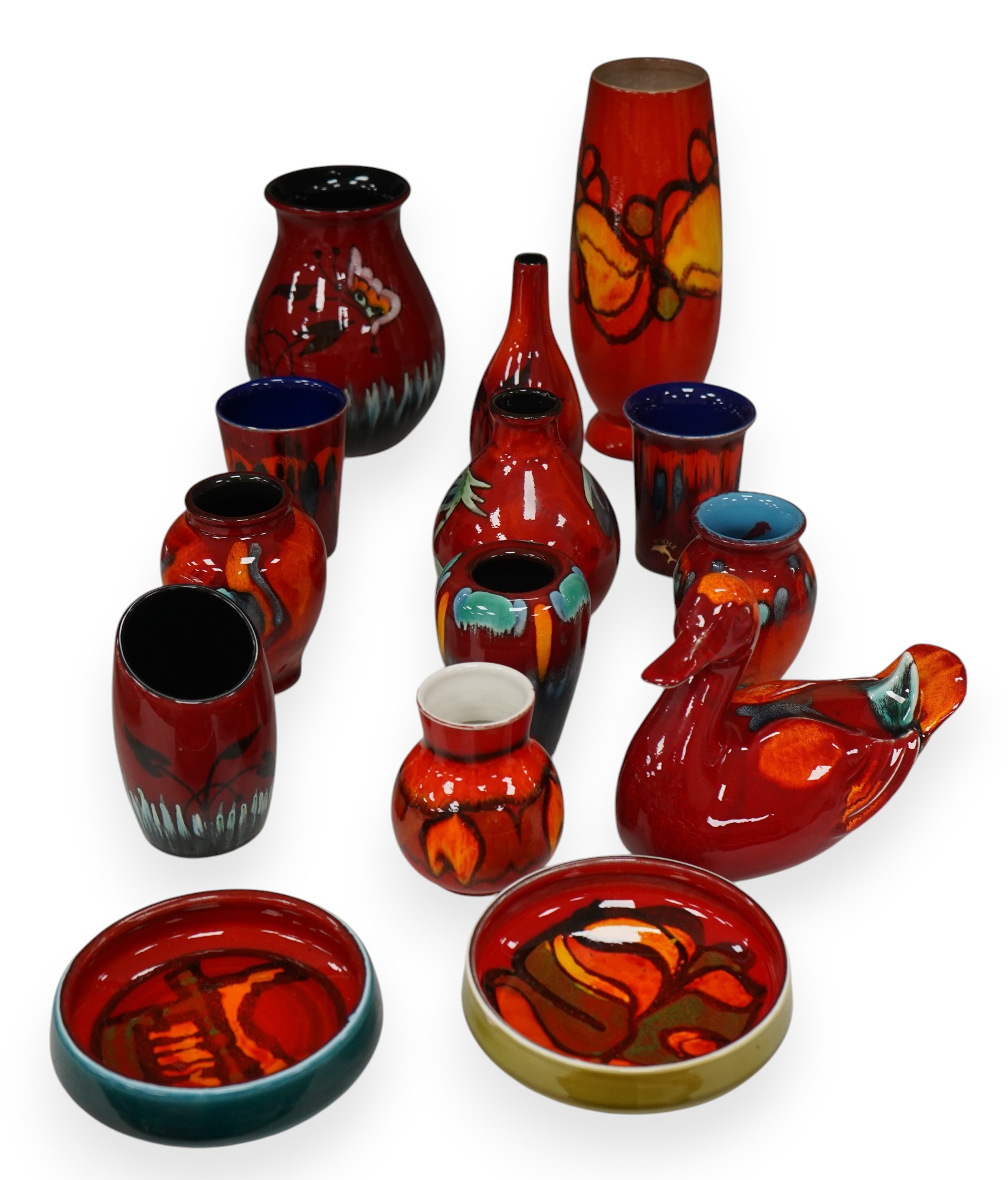 A group of Poole pottery to include vases, beakers and model duck, largest 23cm high (14). Condition - mostly good